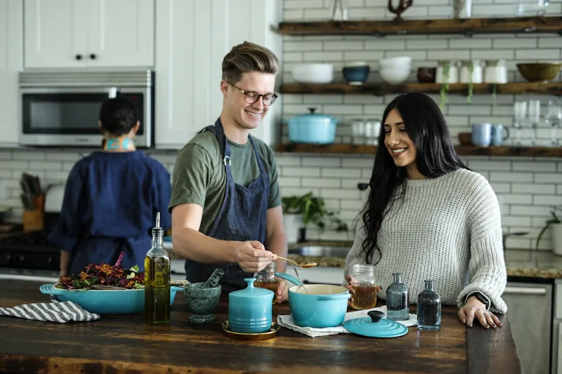 People cooking together in a bright community kitchen