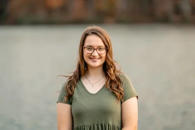 Portrait of a smiling young woman with curly hair
